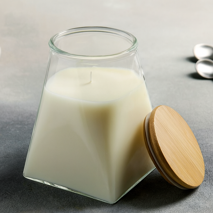 Glass jar with wooden lid containing a white substance on a gray surface